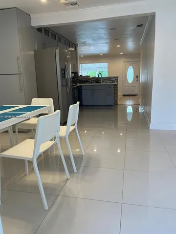 a room with chairs and window