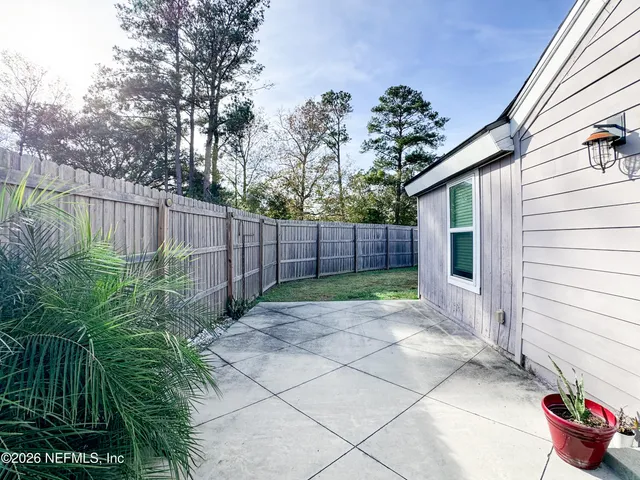 a view of a backyard with green space