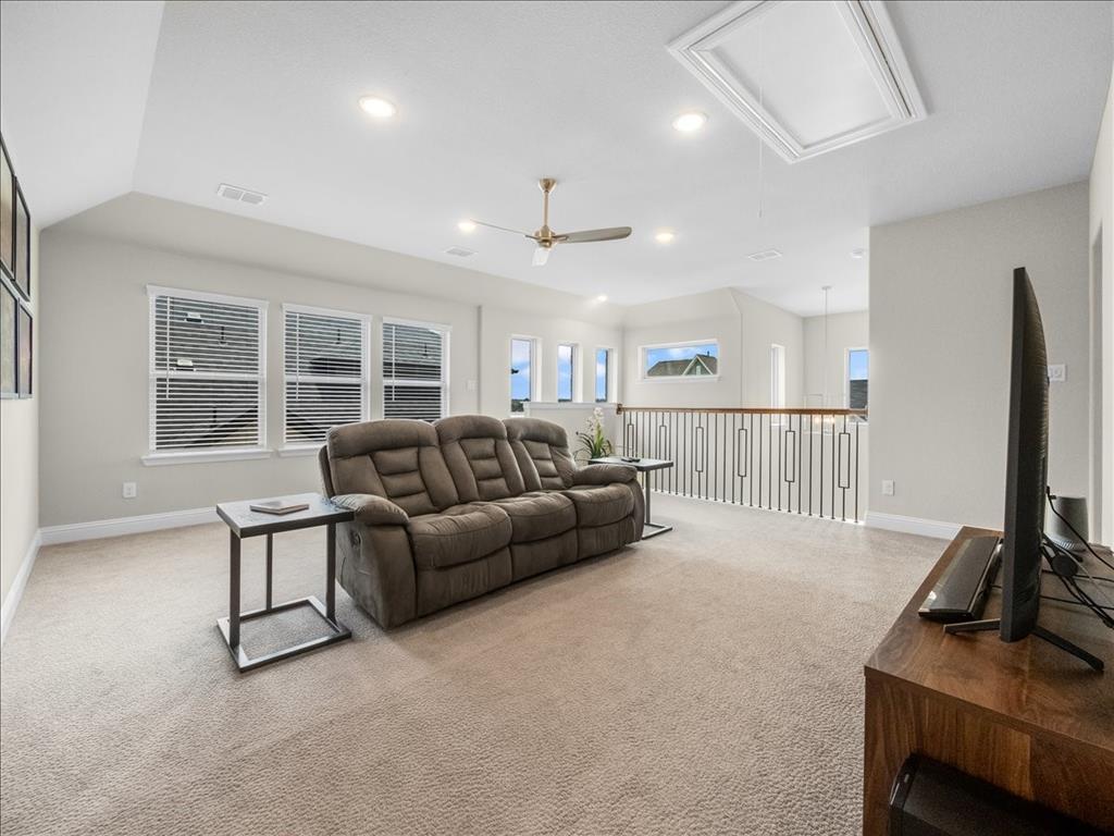8240 Ottowa Ridge Frisco, TX 75034 - Photo 13 of 25 a living room with furniture a flat screen tv and windows