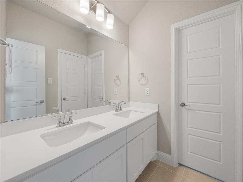 8240 Ottowa Ridge Frisco, TX 75034 - Photo 19 of 25 a bathroom with a sink and a mirror