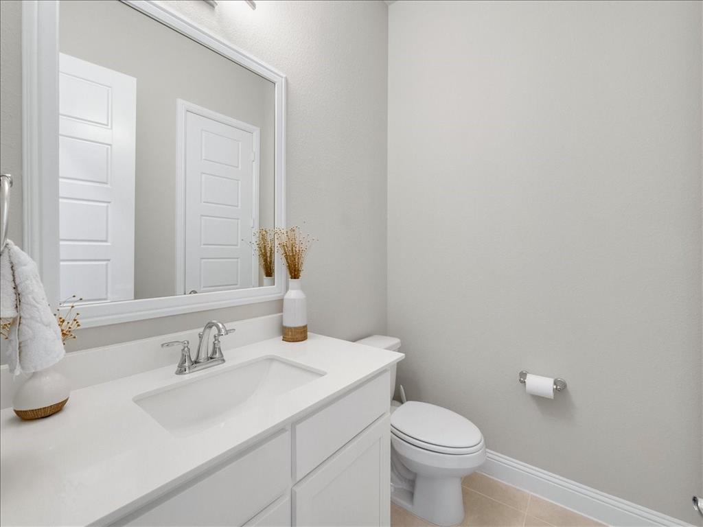 8240 Ottowa Ridge Frisco, TX 75034 - Photo 22 of 25 a bathroom with a sink toilet and a mirror