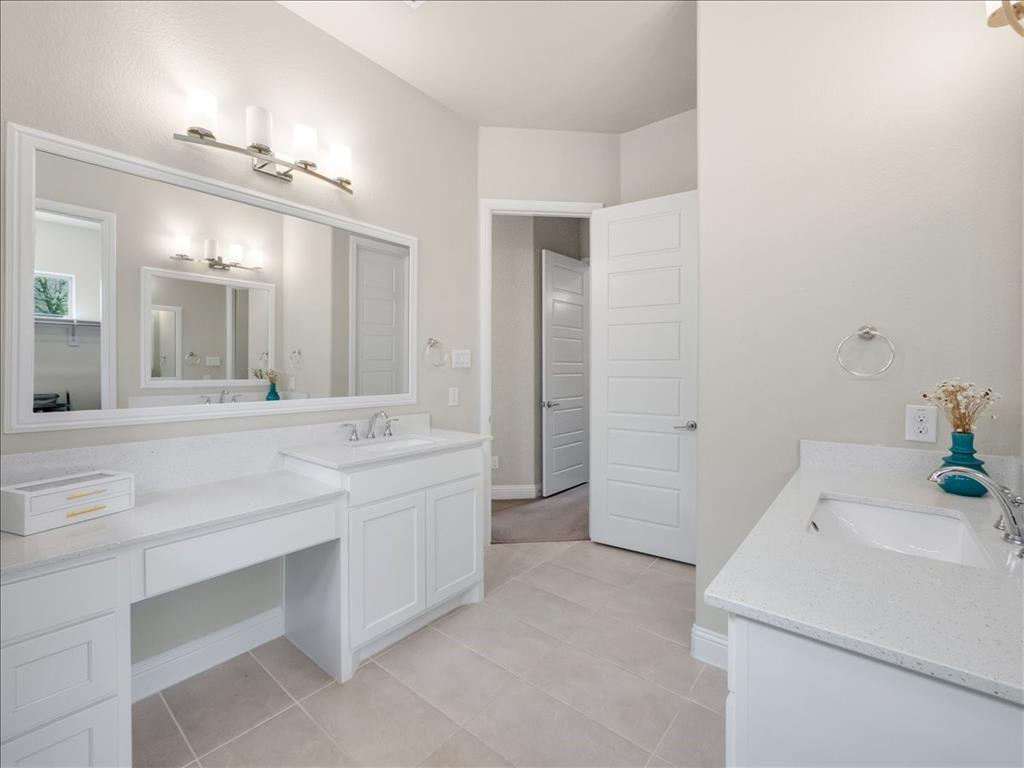 8240 Ottowa Ridge Frisco, TX 75034 - Photo 10 of 25 a bathroom with a sink and a mirror