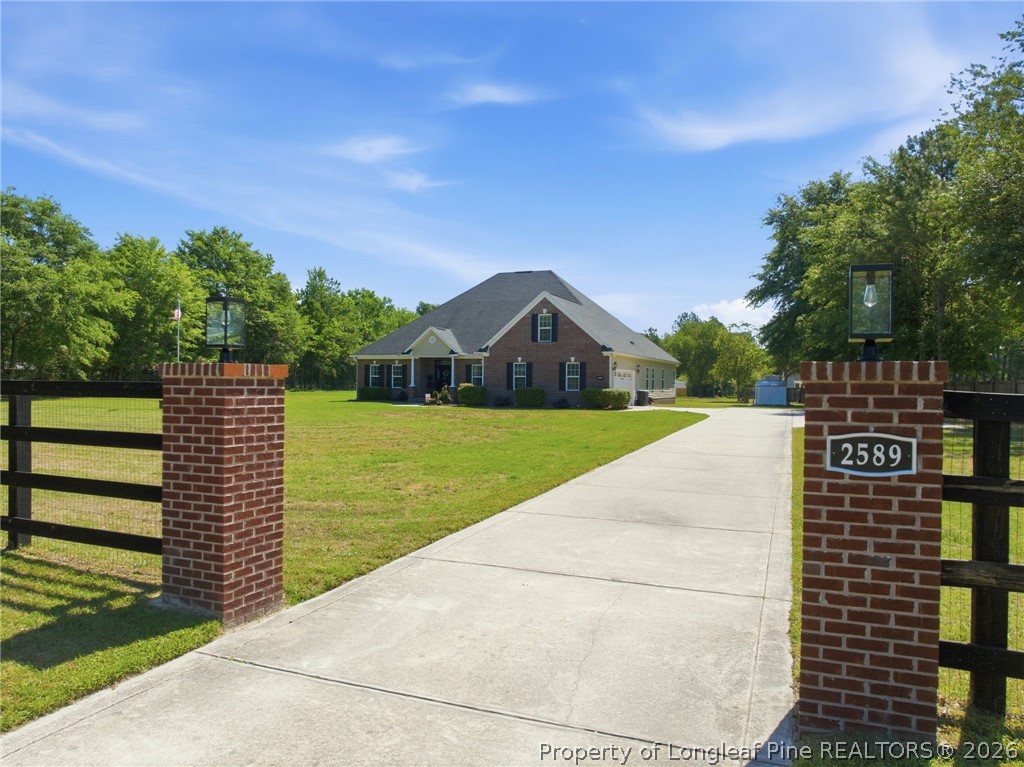 2589 June Johnson Road Raeford, NC 28376 - Photo 45 of 49 a view of a street with a yard
