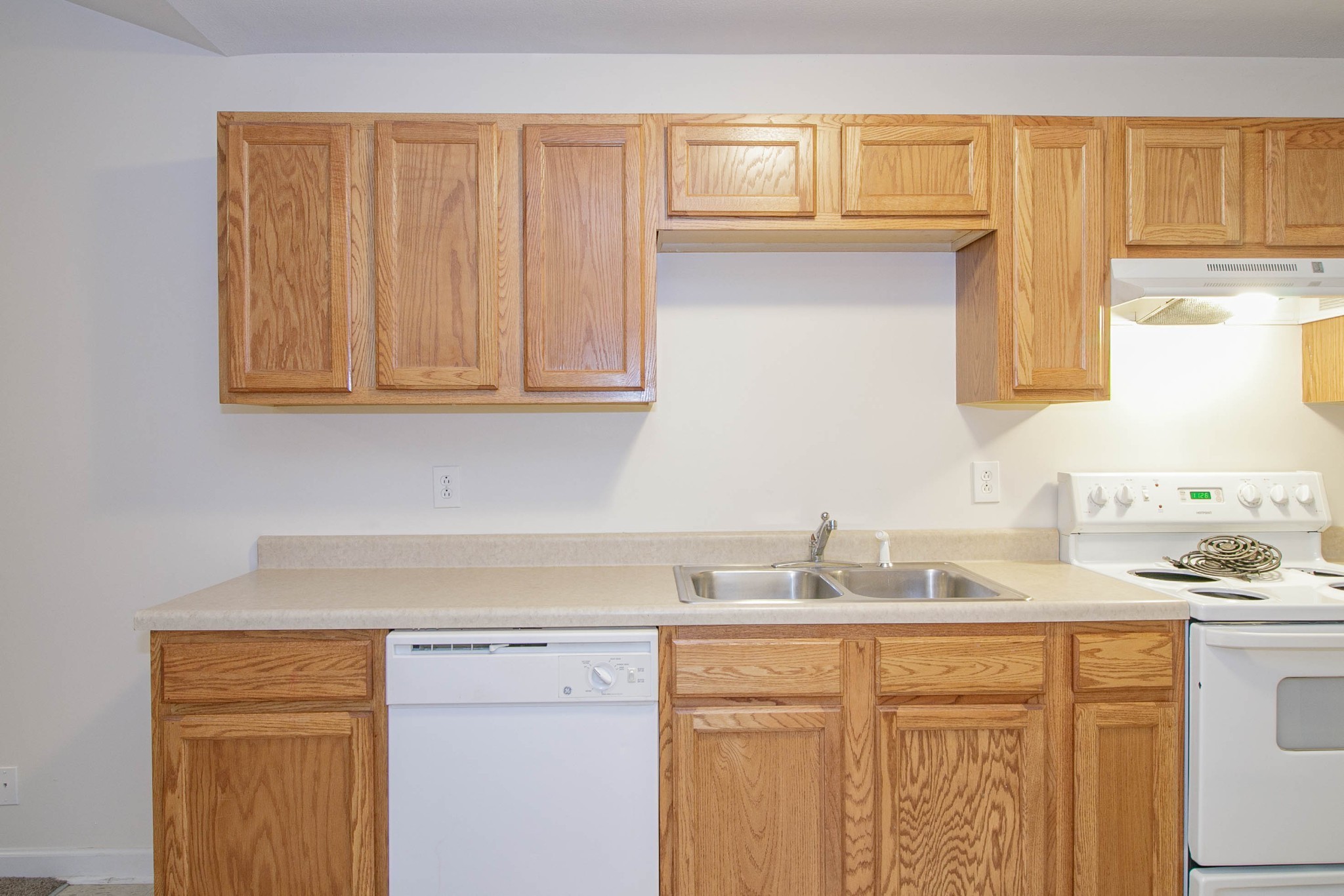 299 Raleigh Drive, Unit F2 Clarksville, TN 37043 - Photo 2 of 27 a kitchen with granite countertop stainless steel appliances white cabinets sink and a window