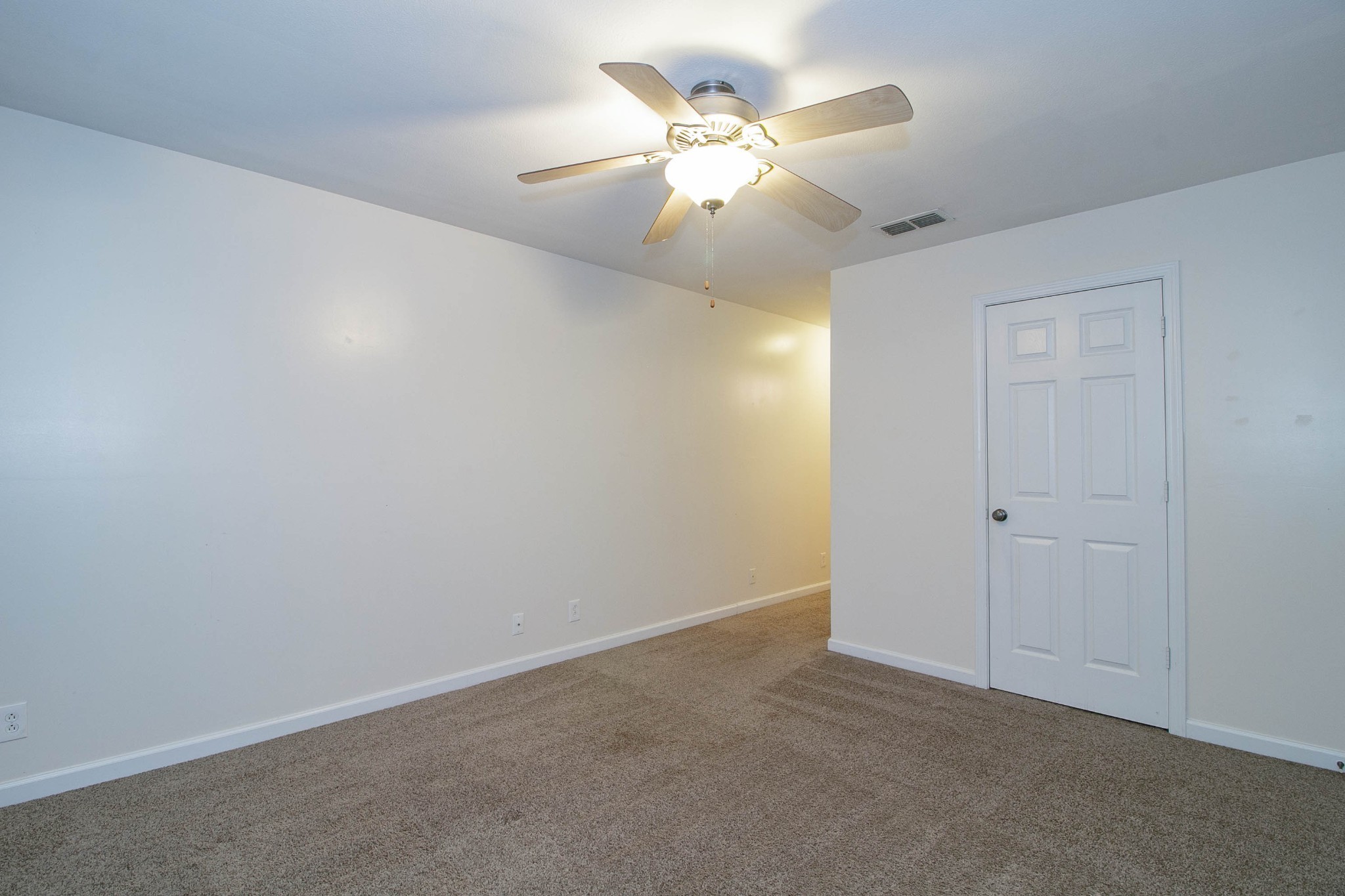299 Raleigh Drive, Unit F2 Clarksville, TN 37043 - Photo 21 of 27 an empty room with a chandelier fan and closet area