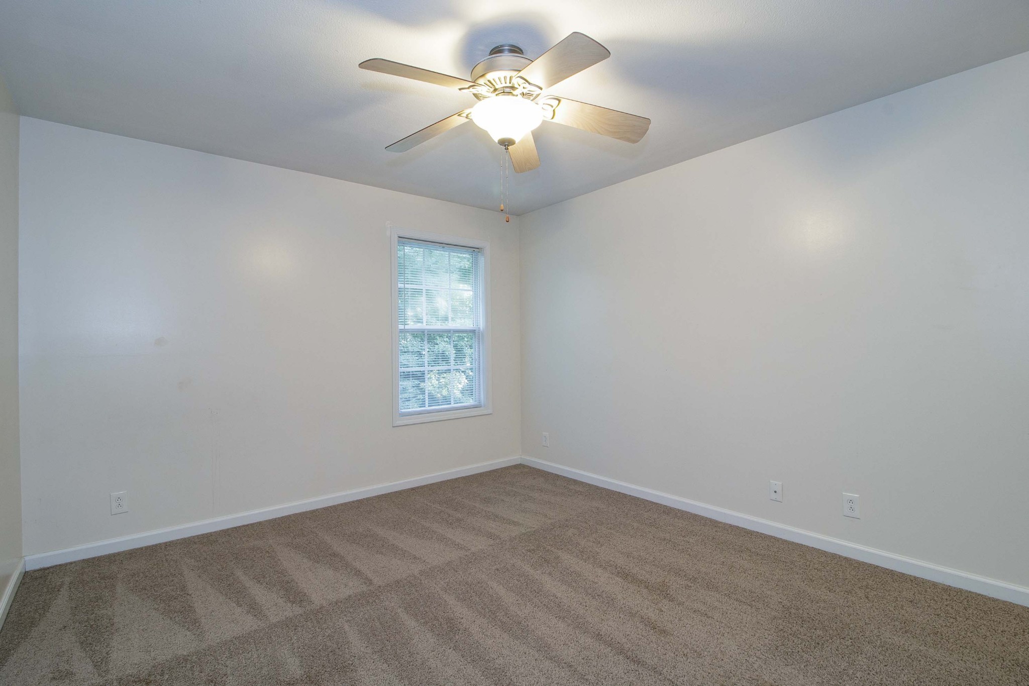 299 Raleigh Drive, Unit F2 Clarksville, TN 37043 - Photo 22 of 27 a view of a room with a ceiling fan and a window