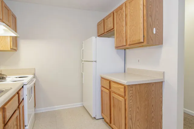 a utility room with cabinets washer and dryer