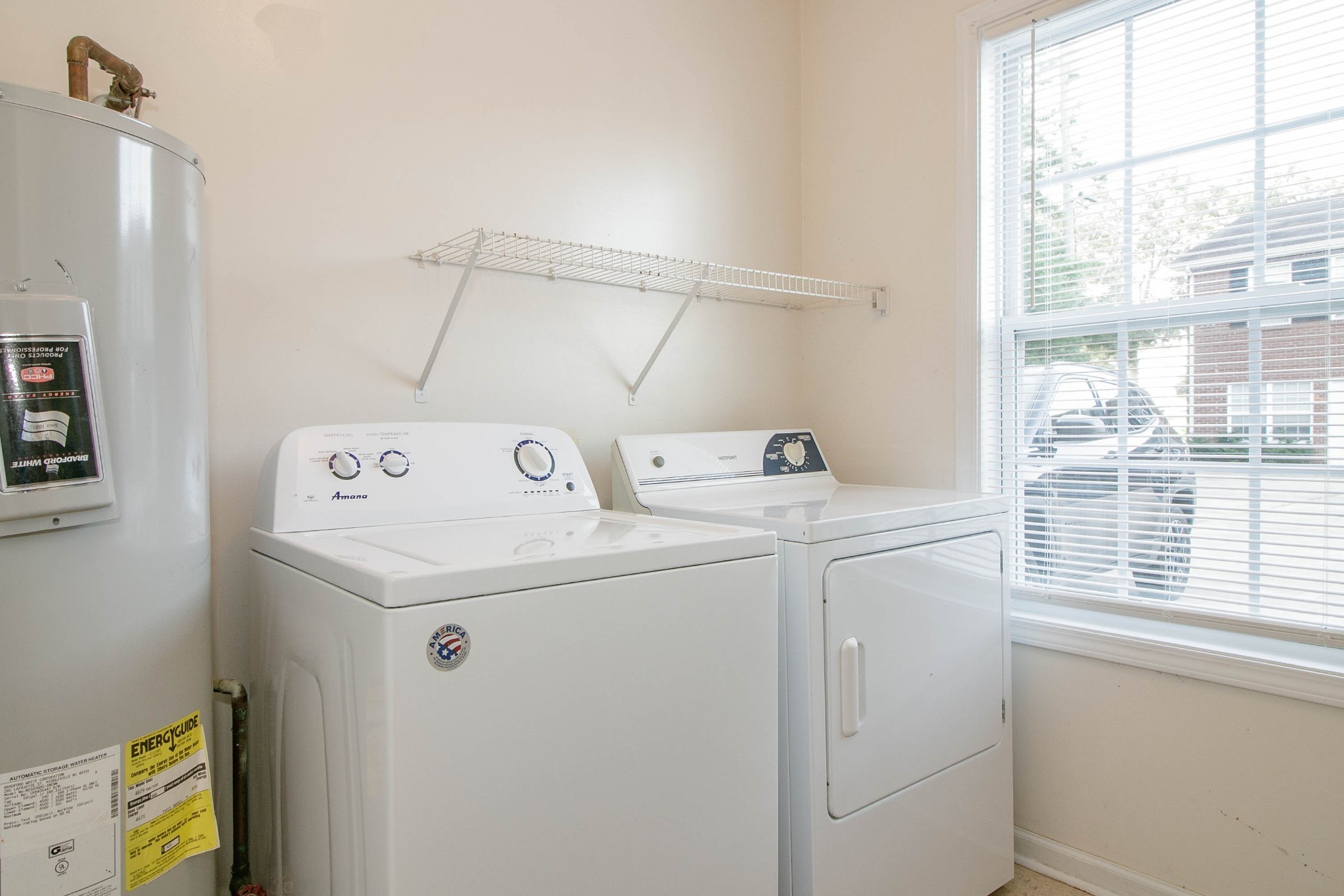 299 Raleigh Drive, Unit F2 Clarksville, TN 37043 - Photo 6 of 27 a utility room with dryer and washer