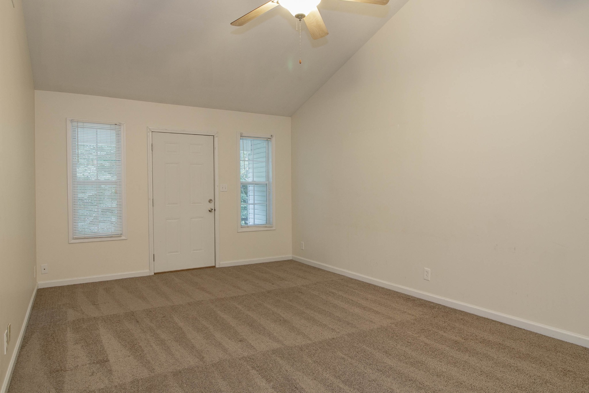 299 Raleigh Drive, Unit F2 Clarksville, TN 37043 - Photo 10 of 27 an empty room with a chandelier fan