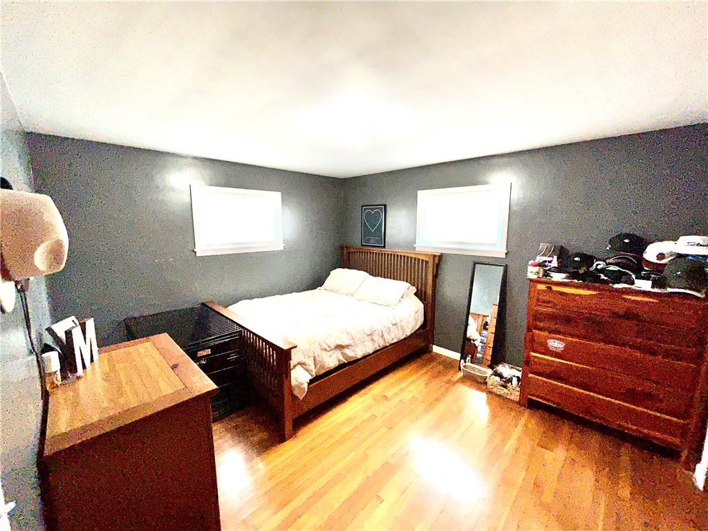502 Ferguson Road Dunbar, PA 15431 - Photo 24 of 32 a bedroom with a bed and wooden floor