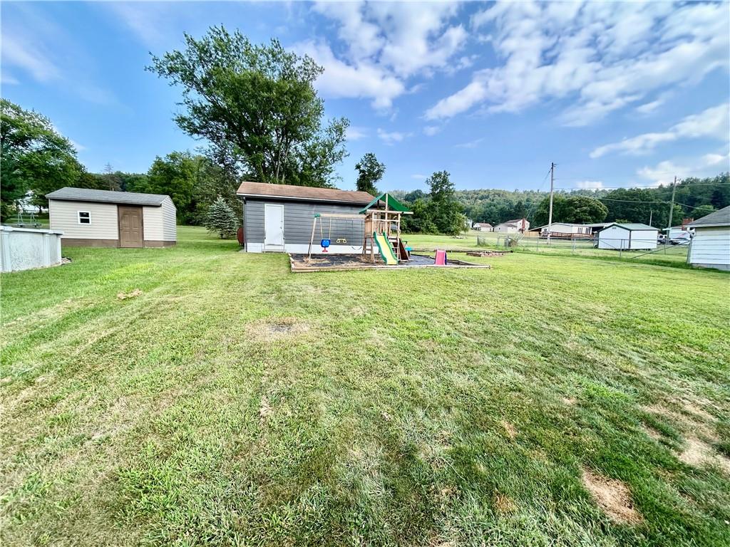 502 Ferguson Road Dunbar, PA 15431 - Photo 6 of 32 a view of a house with a backyard