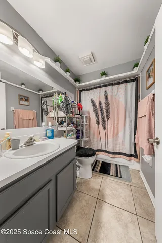 a kitchen with a white cabinets and sink