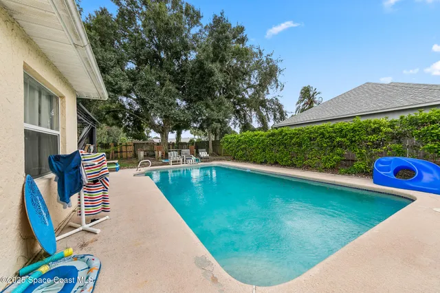 a view of a swimming pool with a patio