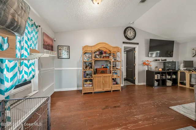 a view of a workspace with furniture and toys