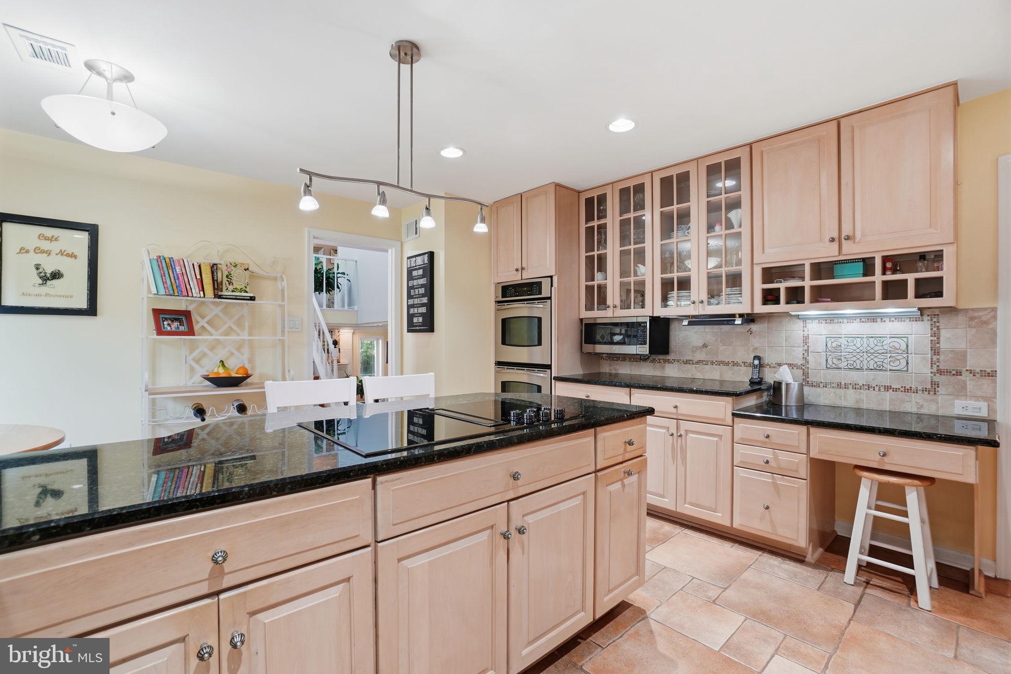 Modern kitchen w/ granite counters & ceramic tile