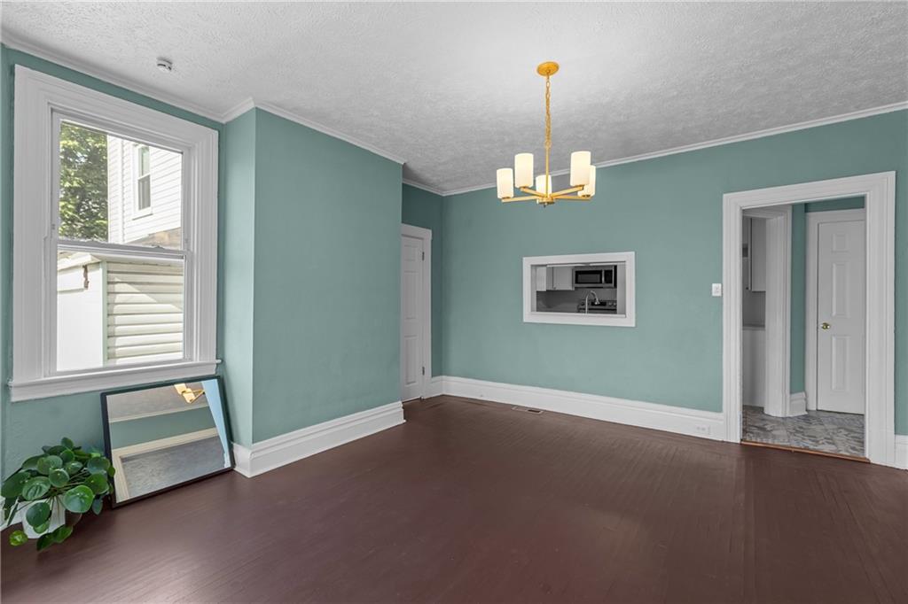 2 Marshall Road Pittsburgh, PA 15214 - Photo 16 of 46 an empty room with wooden floor a ceiling fan and windows