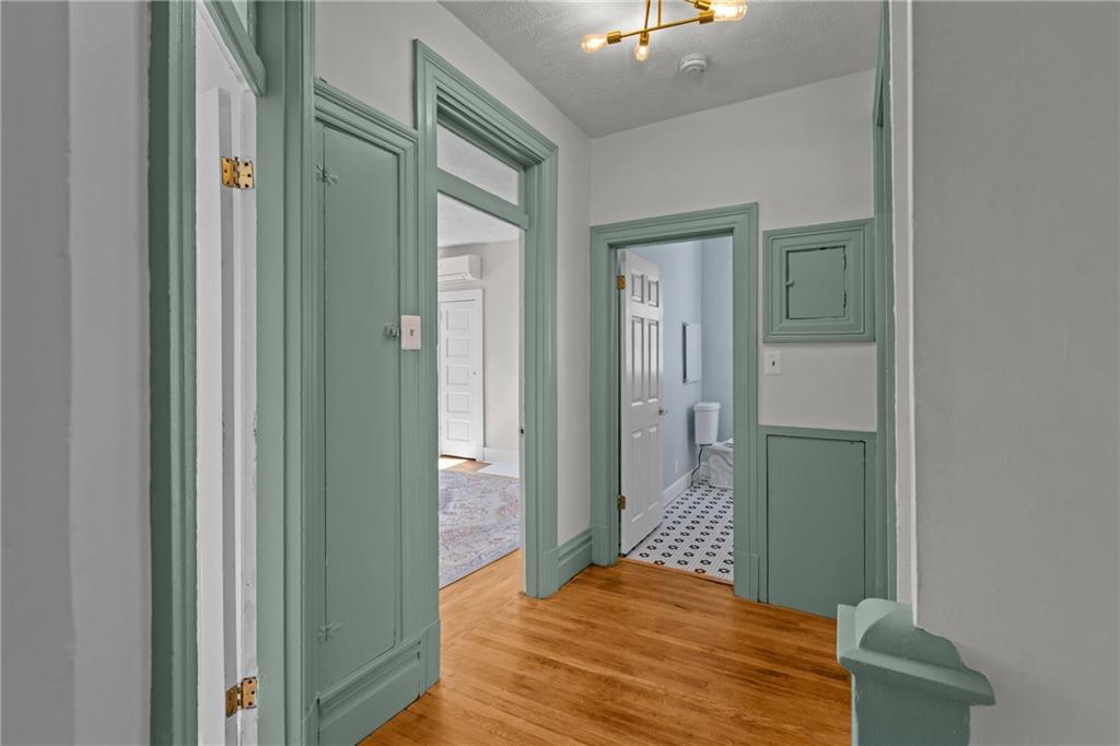 2 Marshall Road Pittsburgh, PA 15214 - Photo 30 of 46 a bedroom with a bed and a chandelier