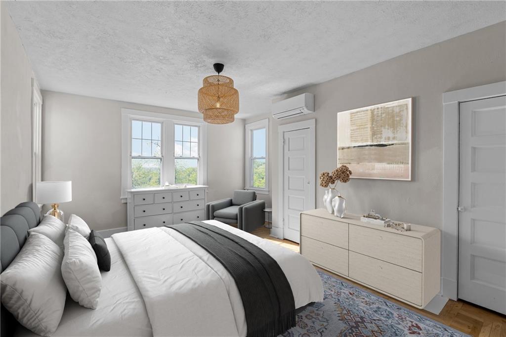 2 Marshall Road Pittsburgh, PA 15214 - Photo 34 of 46 a bedroom with a bed and a chandelier