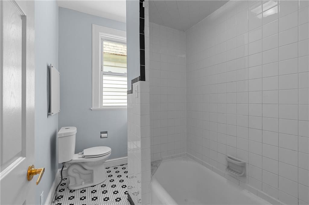 2 Marshall Road Pittsburgh, PA 15214 - Photo 38 of 46 a bathroom with a bathtub toilet and window