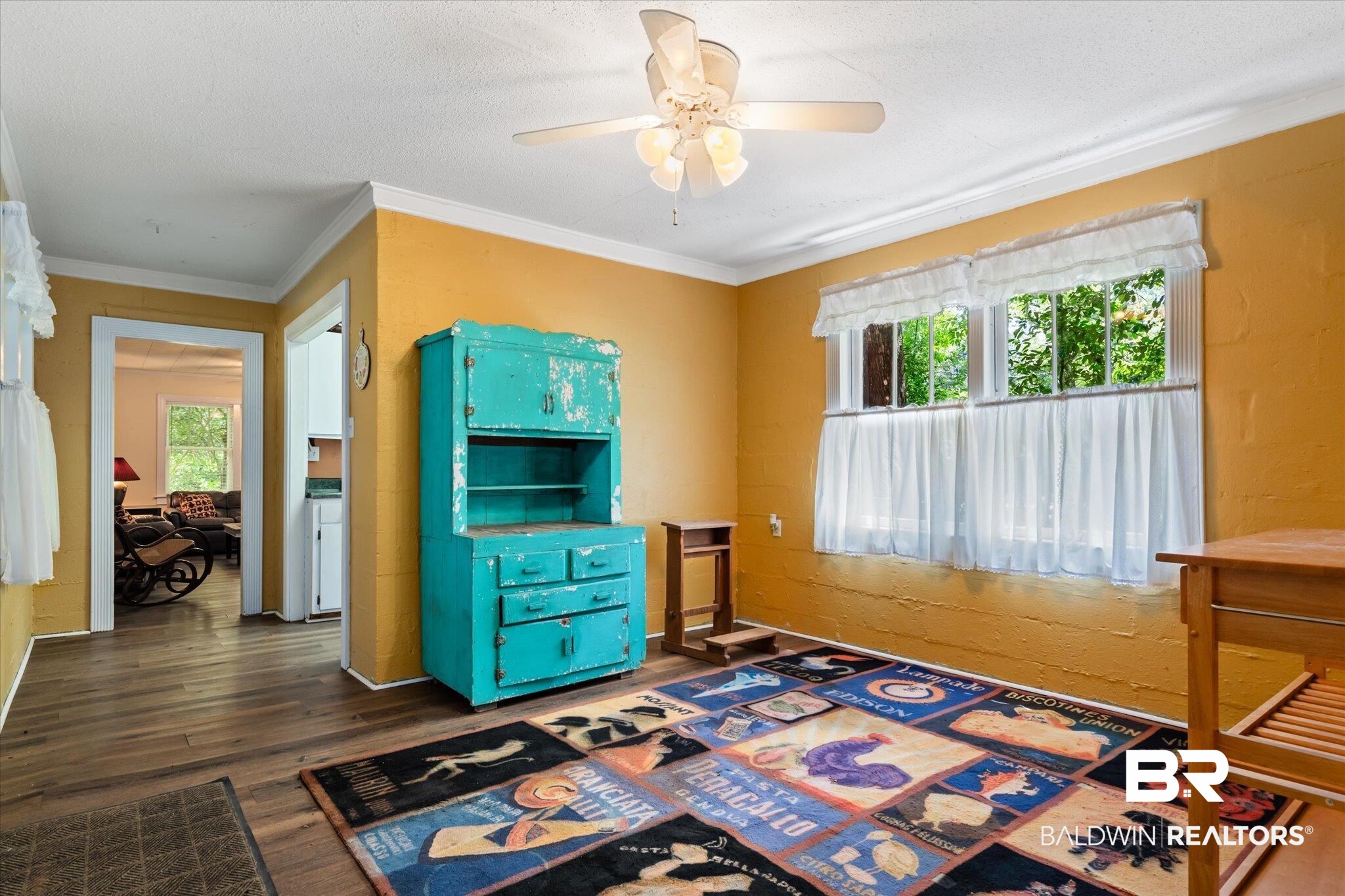 3325 Riviere Du Chien Road Mobile, AL 36693 - Photo 52 of 71 Interior space featuring ceiling fan, dark wood-type flooring, a textured ceiling, and crown molding