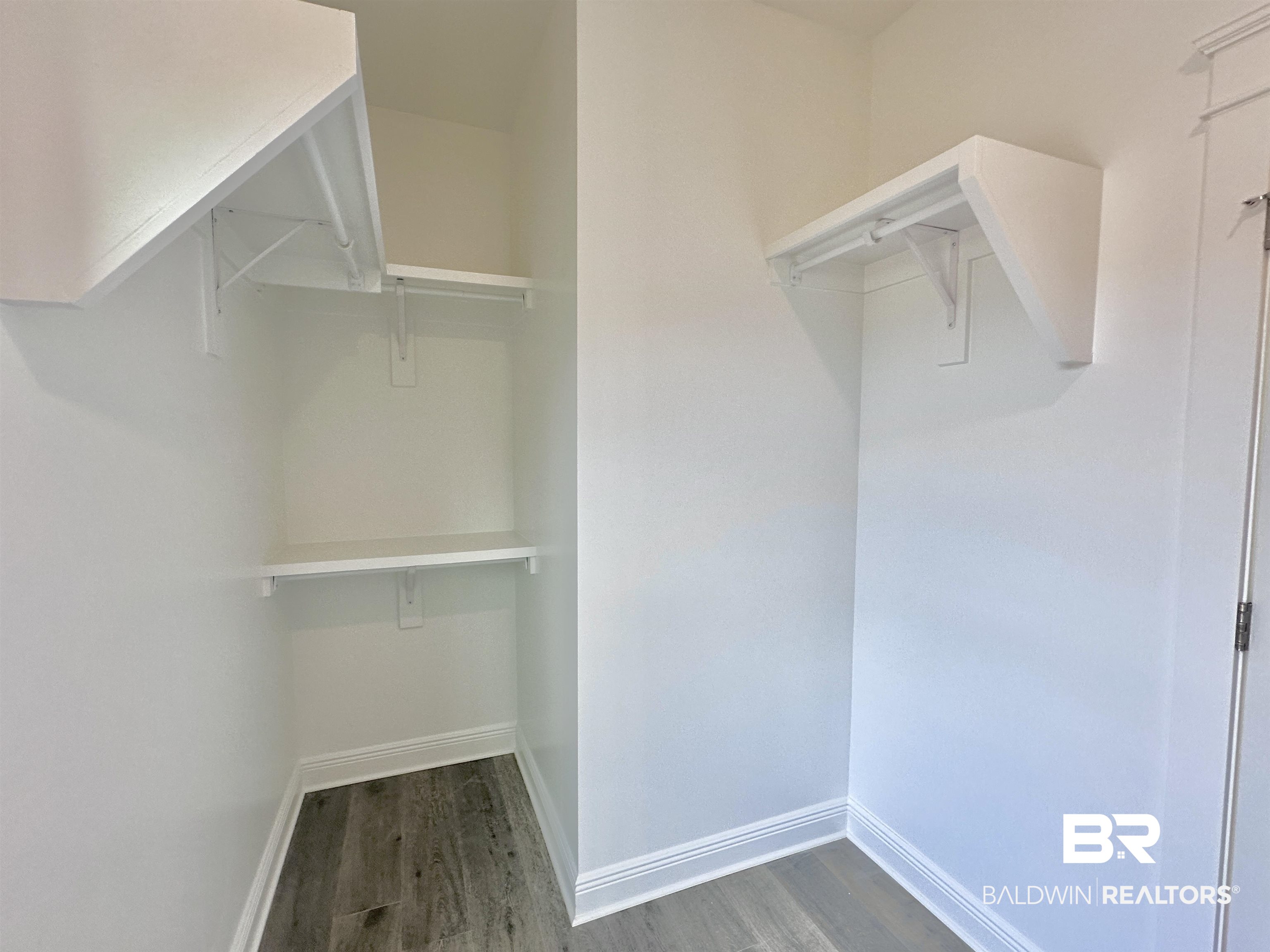 630 Kitfox Avenue Fairhope, AL 36532 - Photo 15 of 40 Spacious closet featuring dark hardwood / wood-style flooring