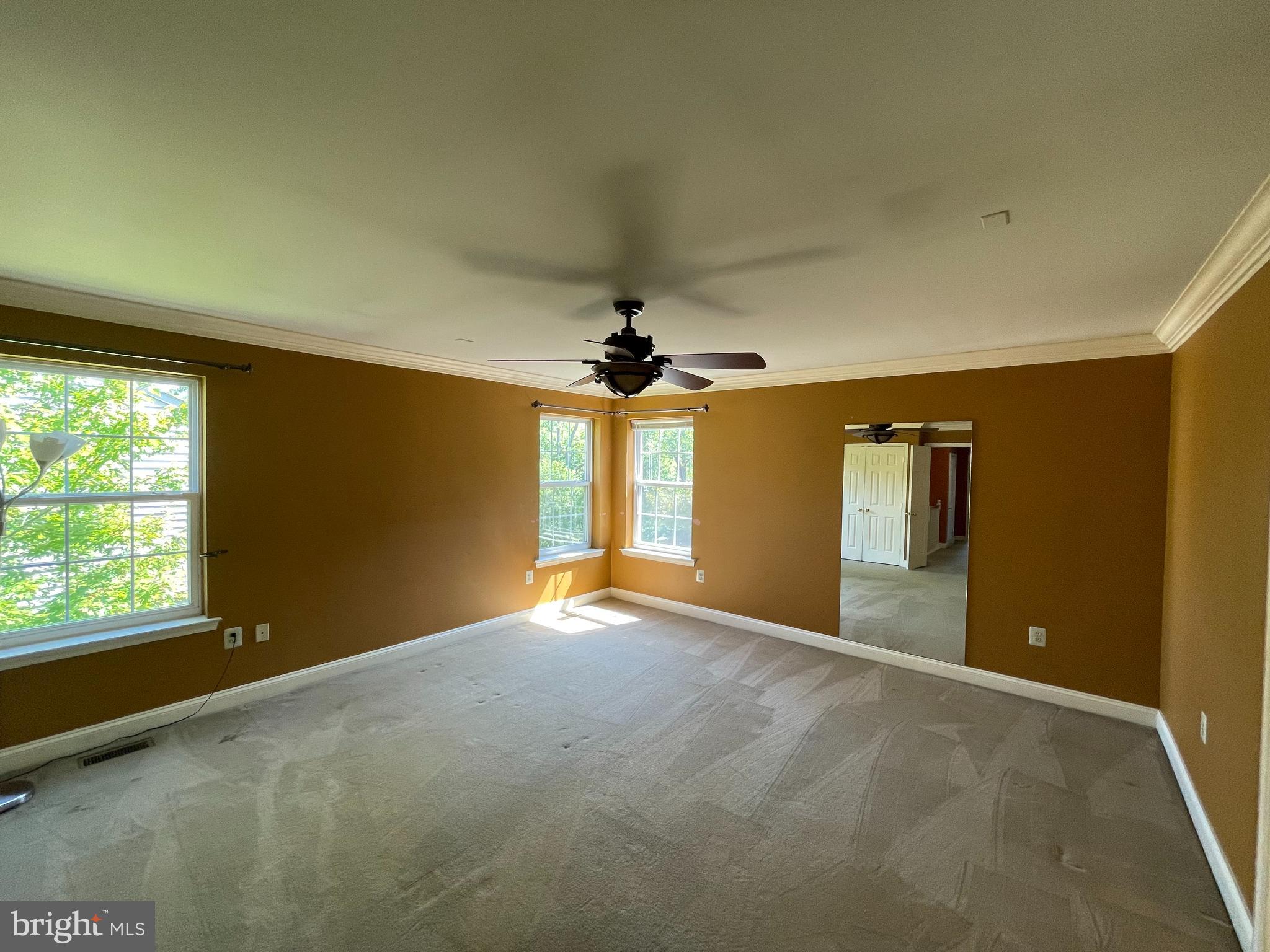 19 Arbor Circle Colmar, PA 18915 - Photo 27 of 60 an empty room with windows and ceiling fan