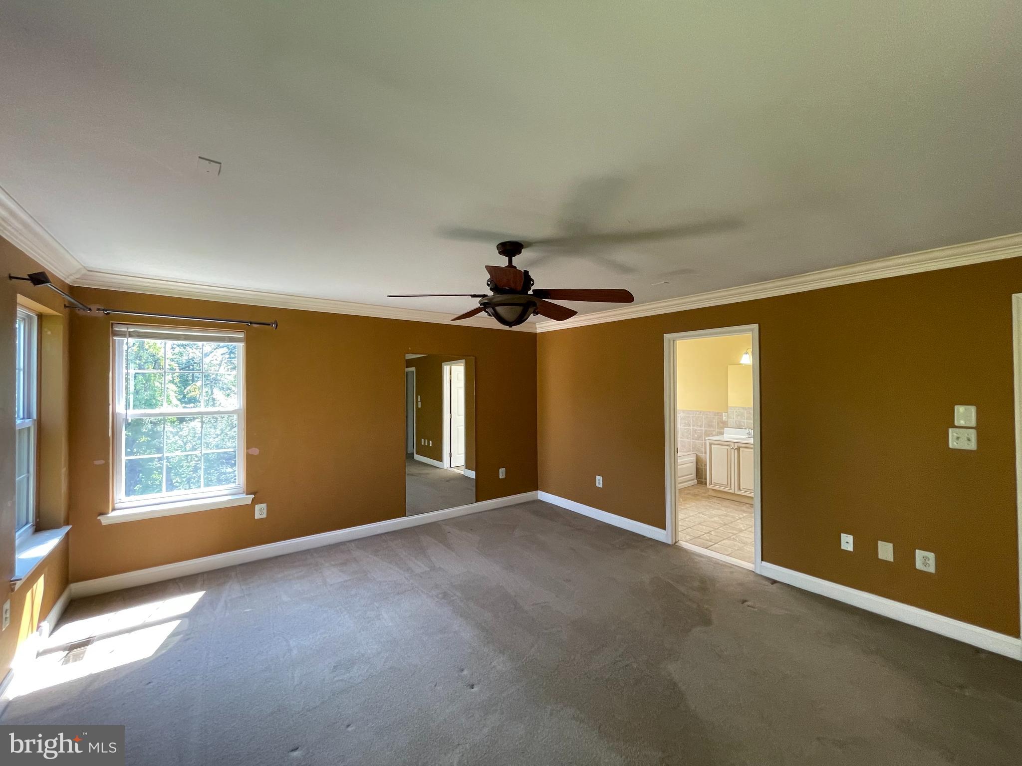 19 Arbor Circle Colmar, PA 18915 - Photo 28 of 60 an empty room with windows and chandelier fan