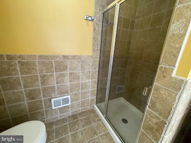 a view of a room with racks on the wall