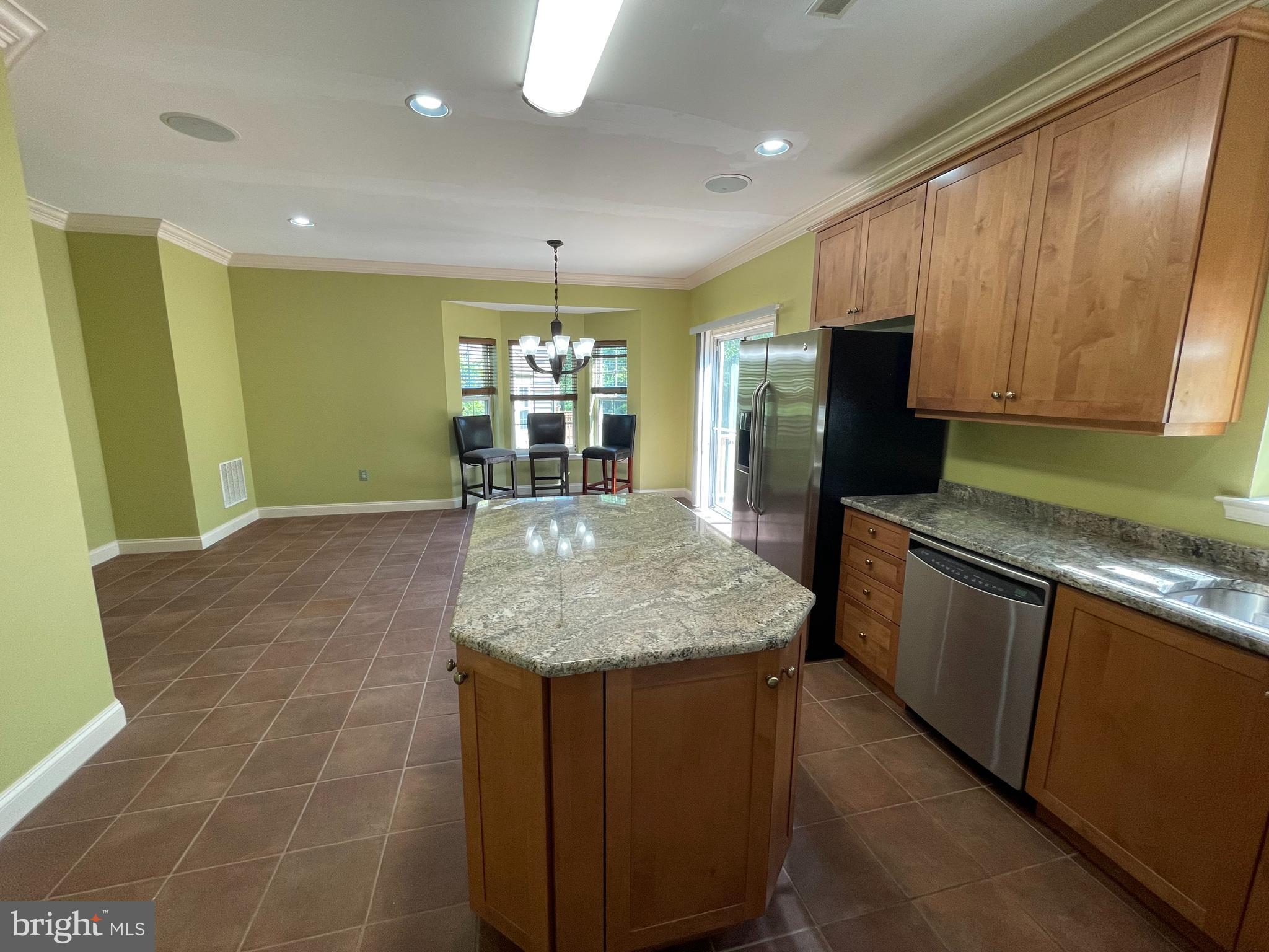 19 Arbor Circle Colmar, PA 18915 - Photo 6 of 60 a kitchen with stainless steel appliances granite countertop a sink dishwasher and a microwave with wooden floor