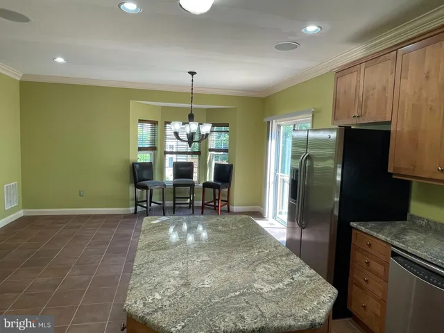 a view of a kitchen with a sink and cabinets
