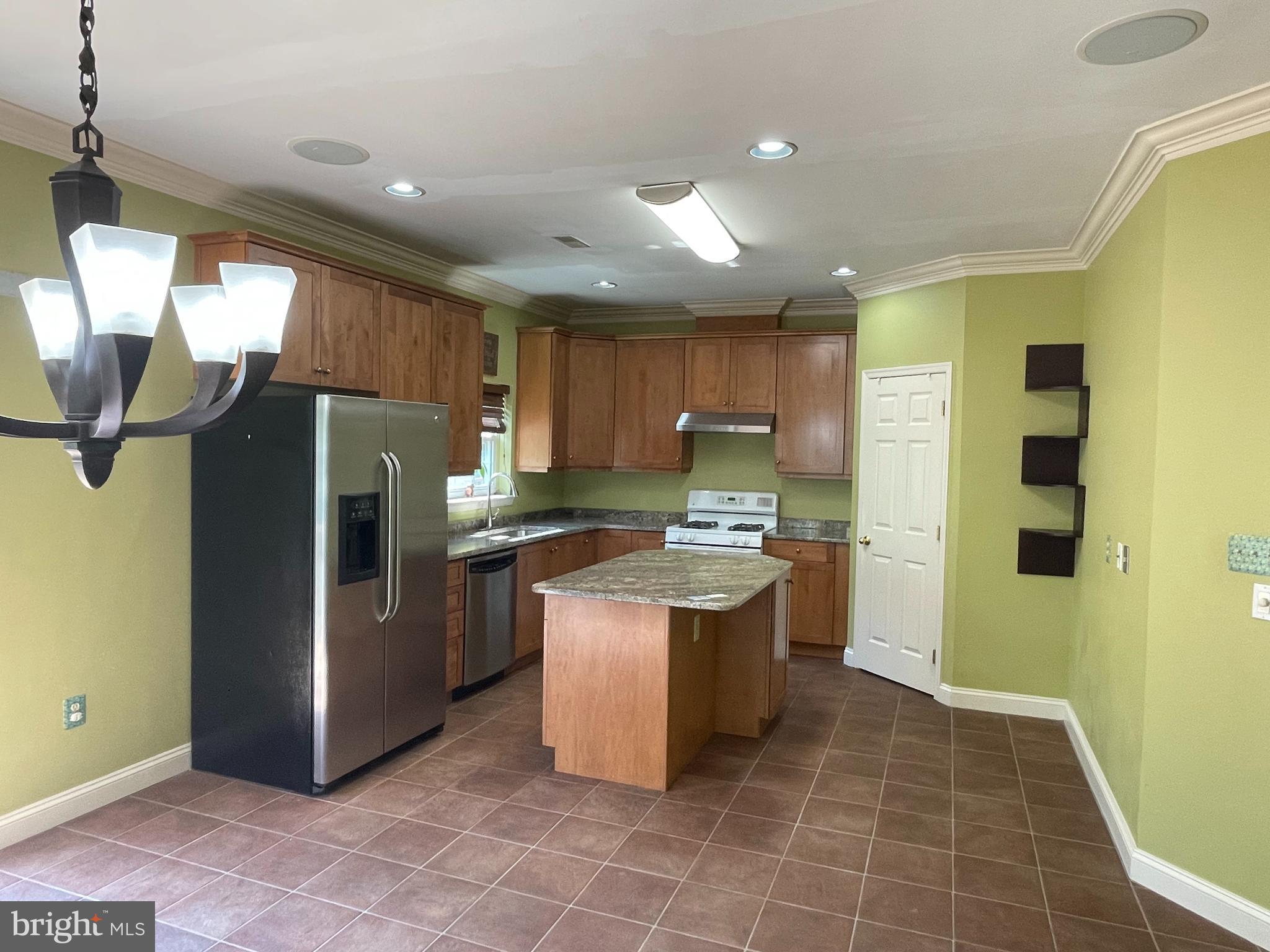 19 Arbor Circle Colmar, PA 18915 - Photo 10 of 60 a kitchen with stainless steel appliances granite countertop a refrigerator a sink a stove and island