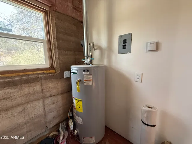 a view of a balcony with chairs and wooden floor