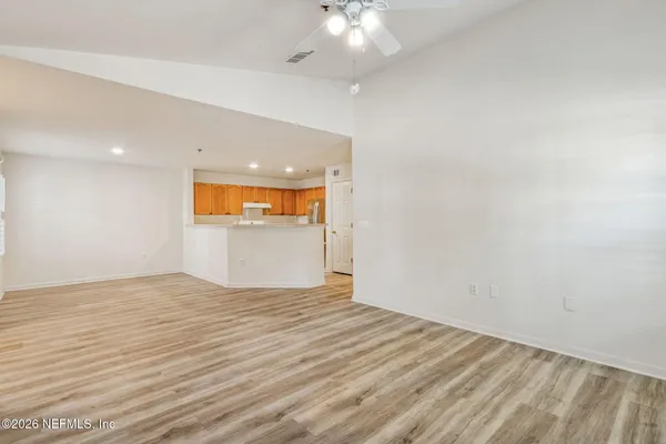 a view of an empty room with a window