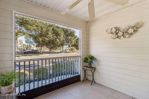 a view of a porch with a floor to ceiling window