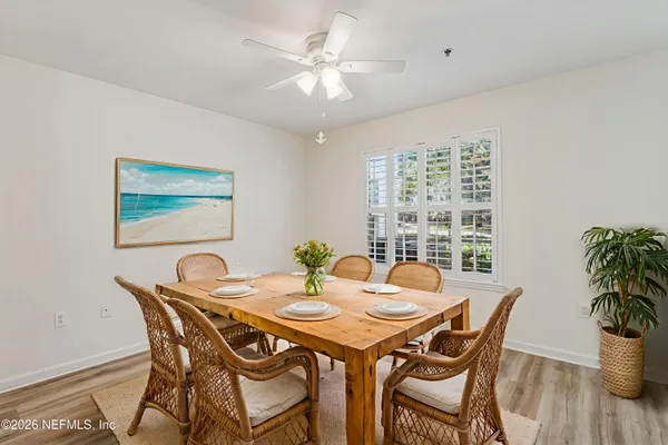 a view of a dining room with furniture window and flowerpot