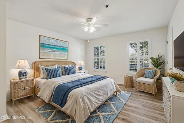 a bedroom with a large bed and a couch