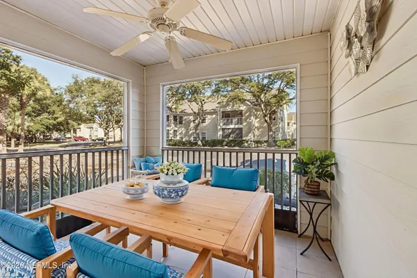 a view of a dining room with furniture window and outside view