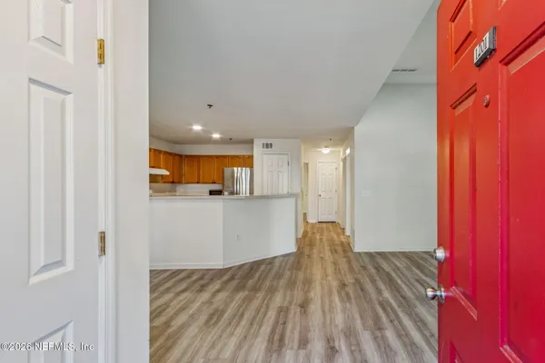 a view of kitchen and wooden floor