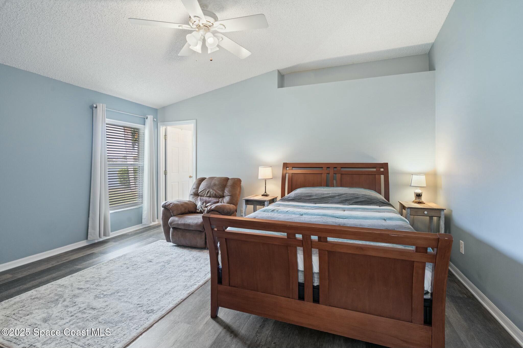 2405 Bayhill Drive Melbourne, FL 32940 - Photo 11 of 36 a bed room with a bed and a window