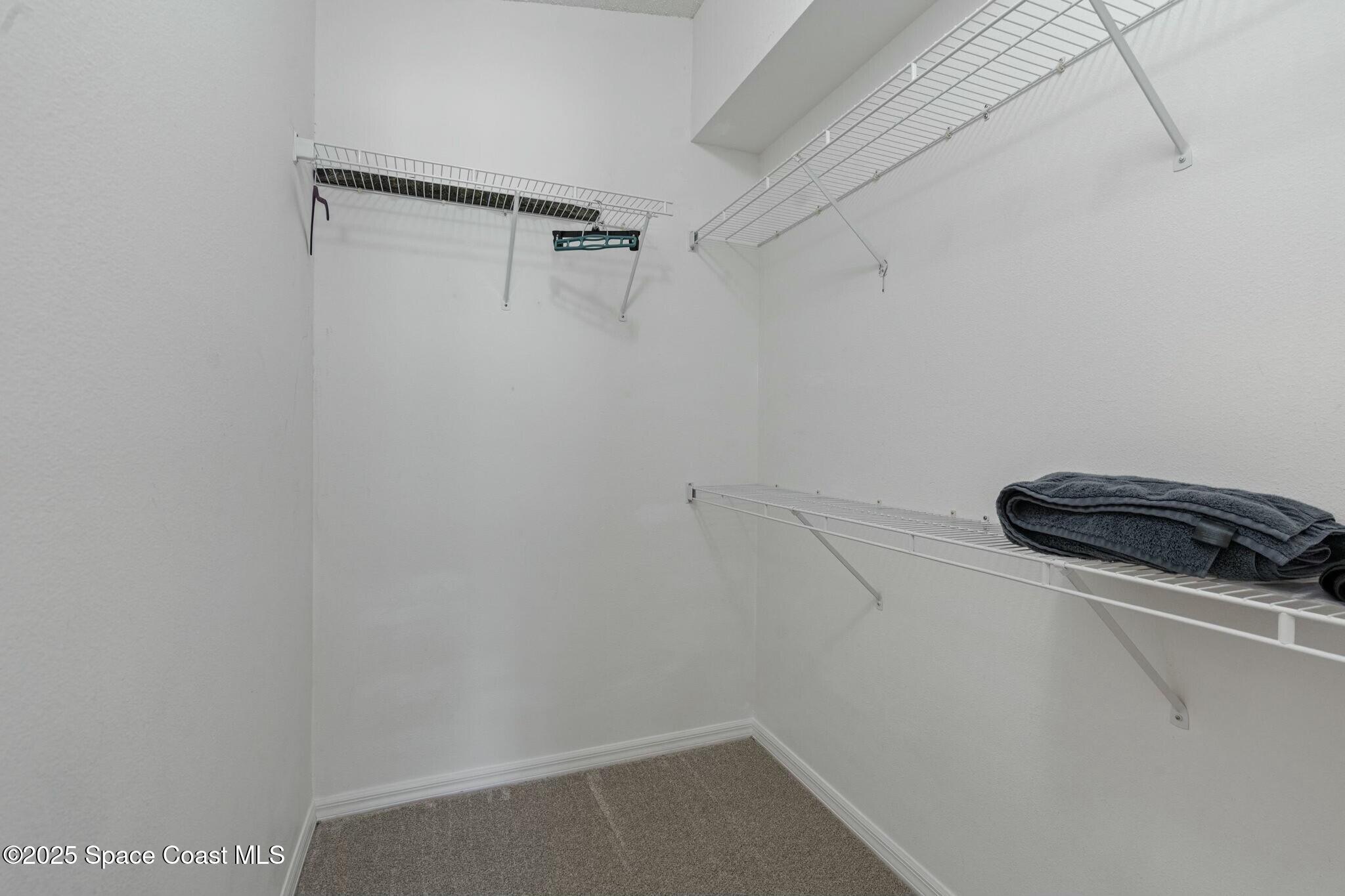 2405 Bayhill Drive Melbourne, FL 32940 - Photo 14 of 36 a view of small space with racks on the wall