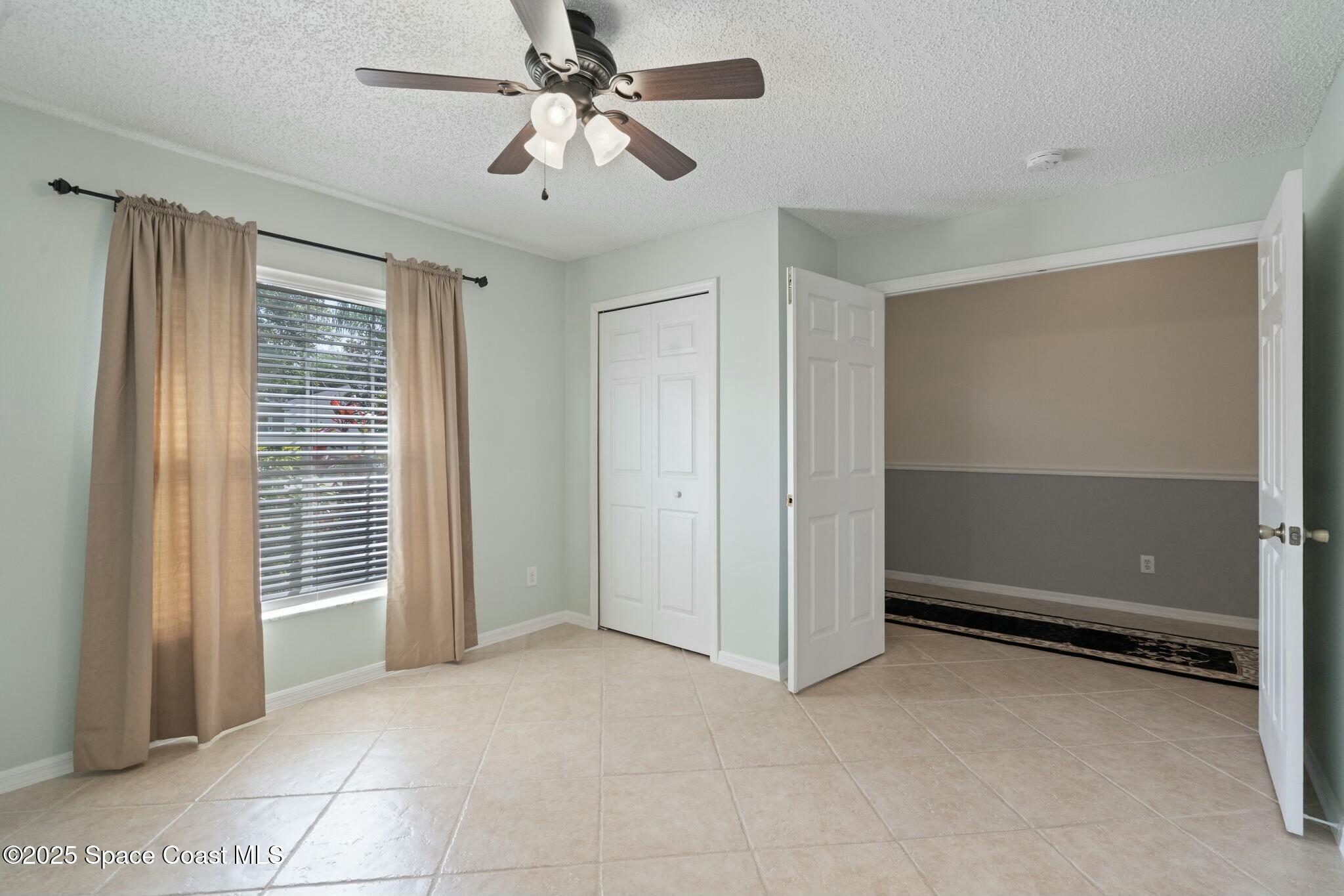 2405 Bayhill Drive Melbourne, FL 32940 - Photo 19 of 36 a view of an empty room with a window