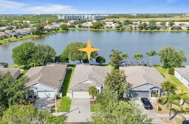 2405 Bayhill Drive Melbourne, FL 32940 - Photo 2 of 36 an aerial view of a house with a lake view
