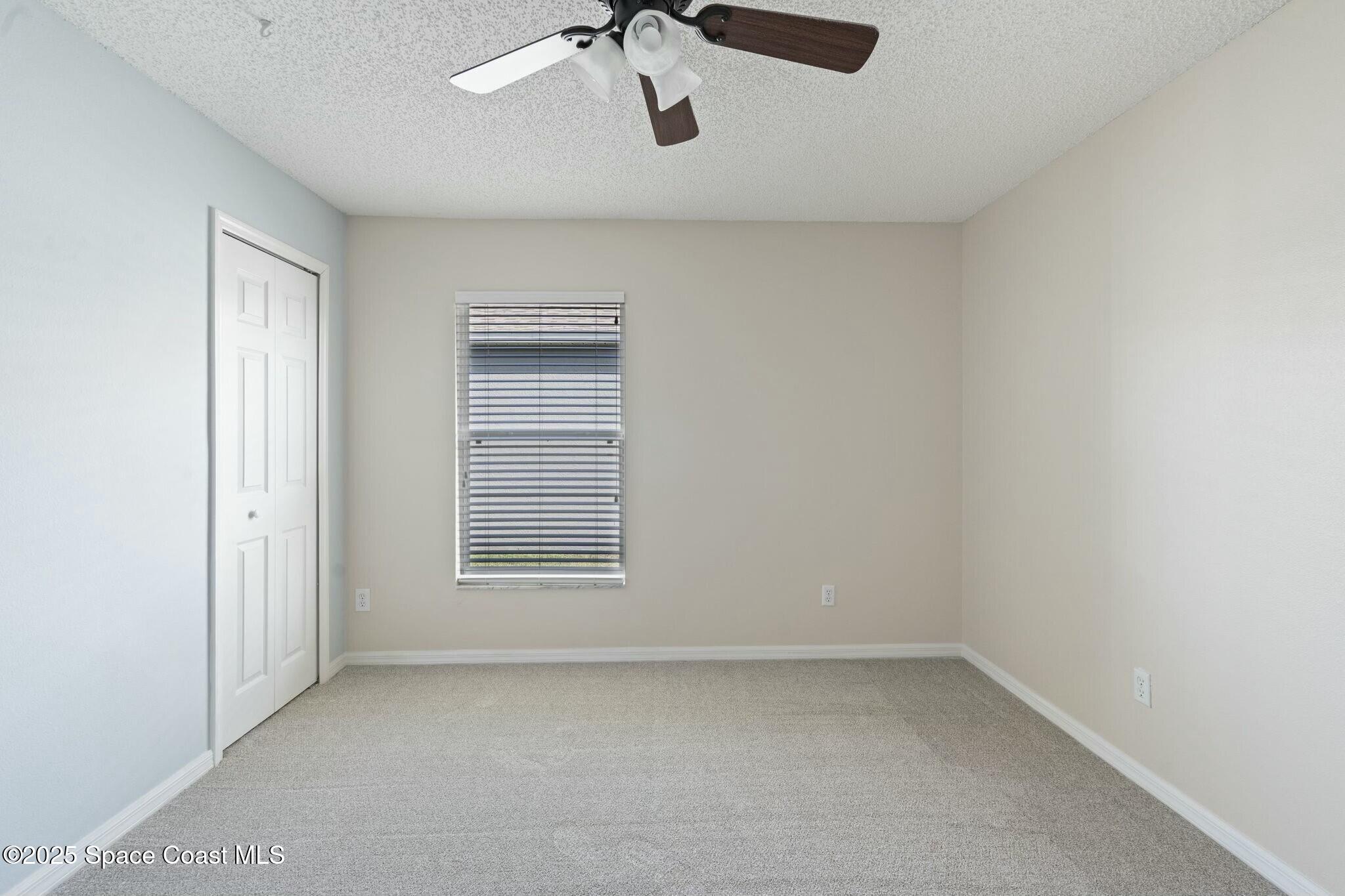 2405 Bayhill Drive Melbourne, FL 32940 - Photo 23 of 36 a view of an empty room with a window