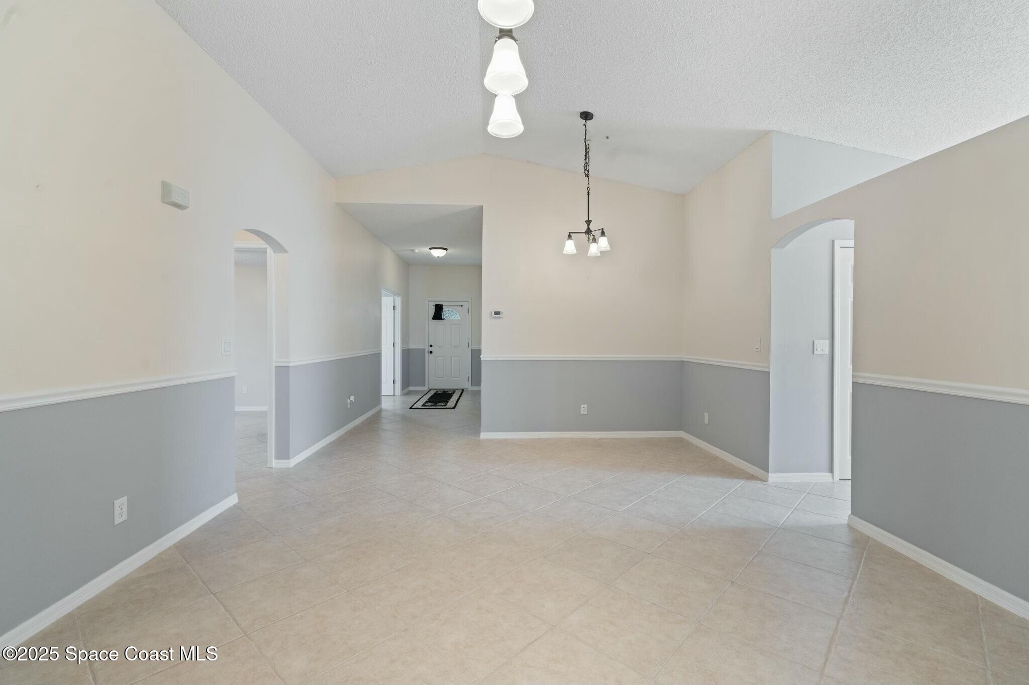 2405 Bayhill Drive Melbourne, FL 32940 - Photo 24 of 36 a view of empty room with a fireplace