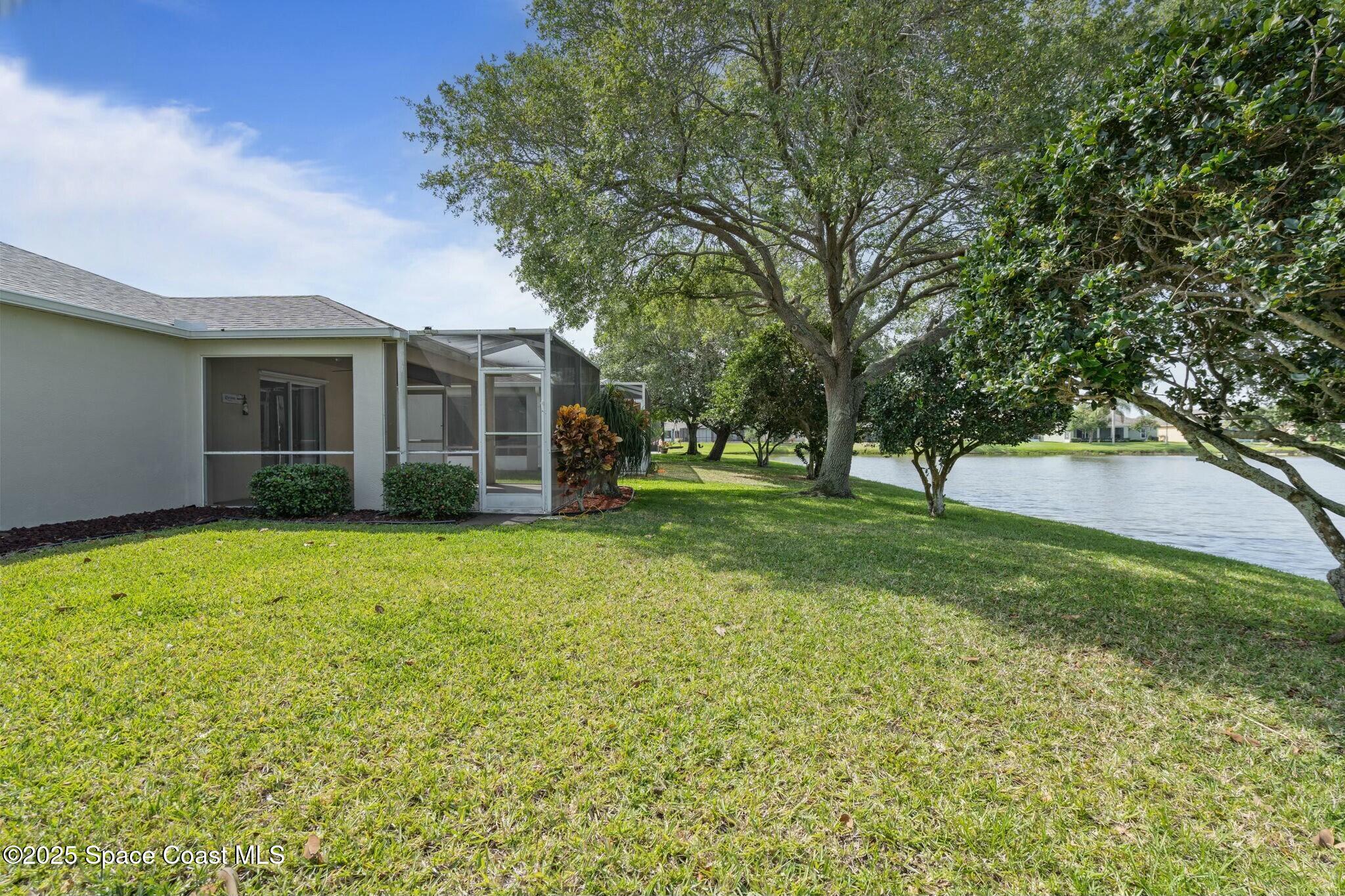 2405 Bayhill Drive Melbourne, FL 32940 - Photo 29 of 36 a view of a house with yard and tree s