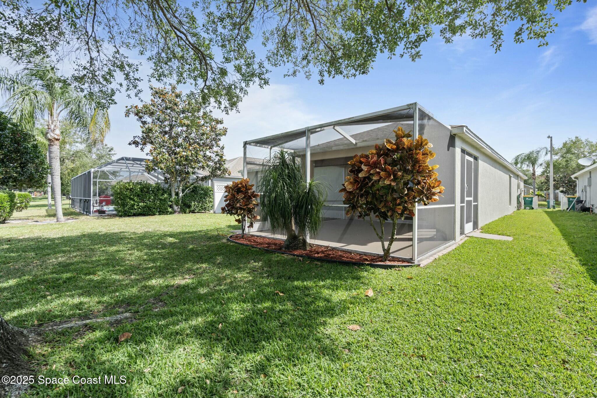 2405 Bayhill Drive Melbourne, FL 32940 - Photo 30 of 36 a view of a house with a yard porch and sitting area