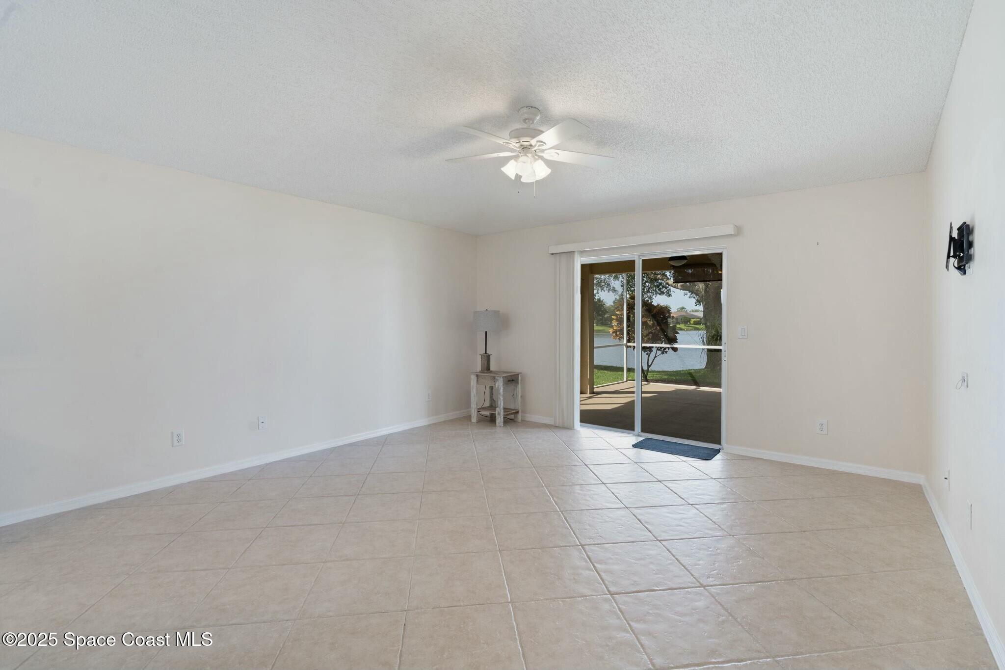 2405 Bayhill Drive Melbourne, FL 32940 - Photo 9 of 36 a view of an empty room with a window
