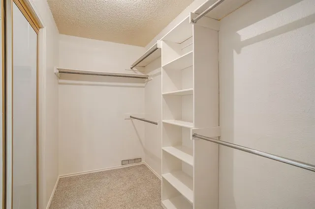 a view of an empty walk in closet