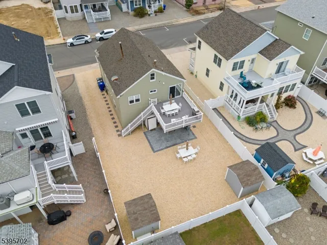 an aerial view of residential house with outdoor space and parking