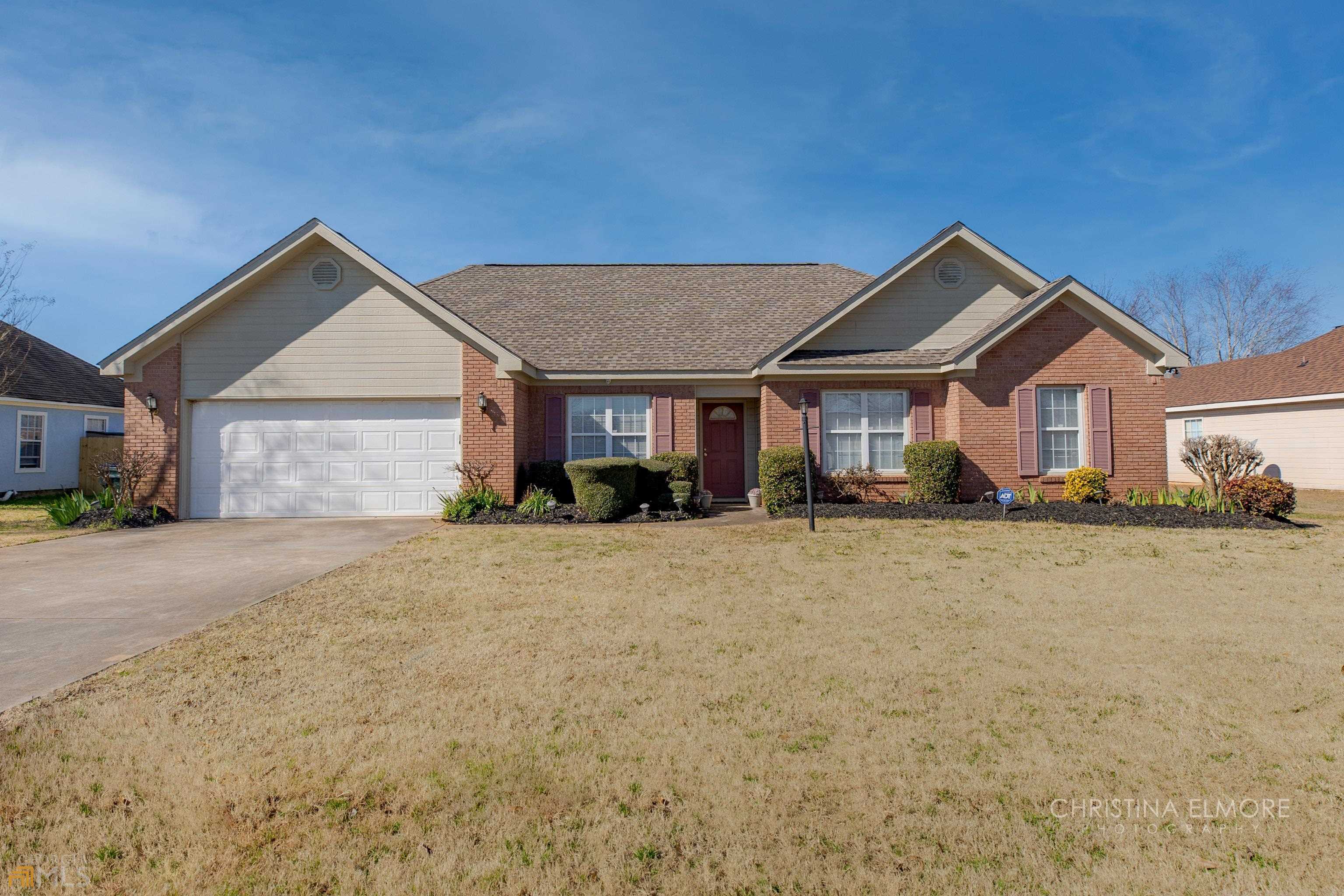 311 Bryson Way Warner Robins, GA 31088 - Photo 1 of 1 a front view of a house with a yard and garage